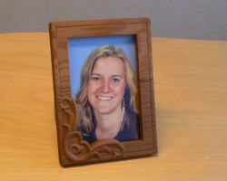 Wooden picture fram with photo of girl